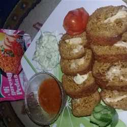 Indomie gordon blue with coleslaw salad and sauce barbeque